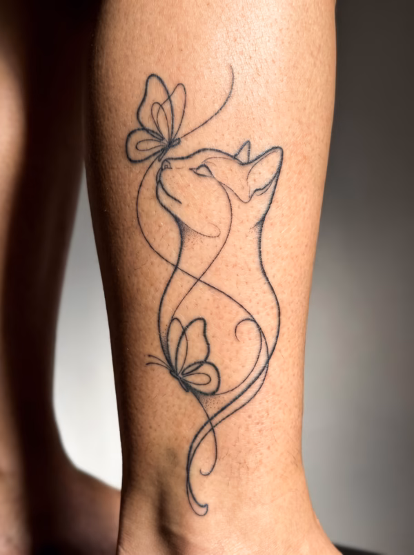 Printable cat and butterflies line art tattoo design with a graceful cat silhouette, delicate butterflies, flowing lines, and soft dotwork shading mockup